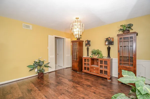 a view of a living room with hardwood floor