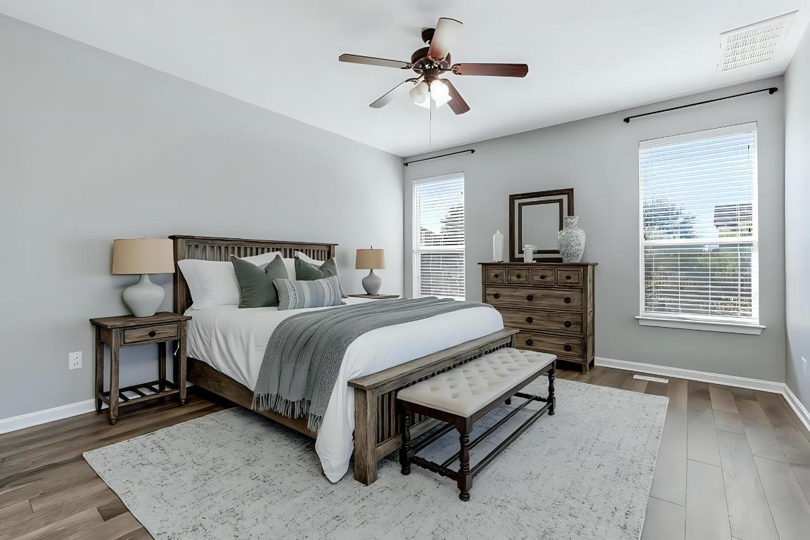 299 Limestone Trail Austin, TX 78737 - Photo 6 of 19 a spacious bedroom with a bed a chandelier and a dresser