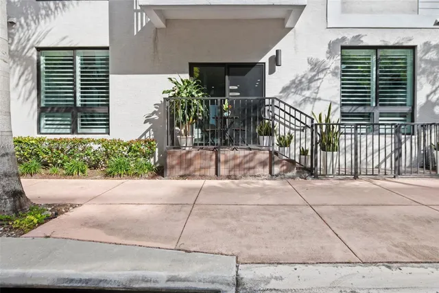 a living room with furniture and a gate