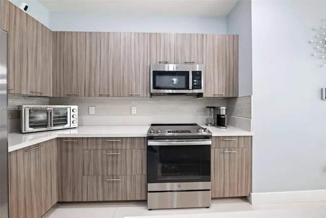 a kitchen with a stove and a microwave