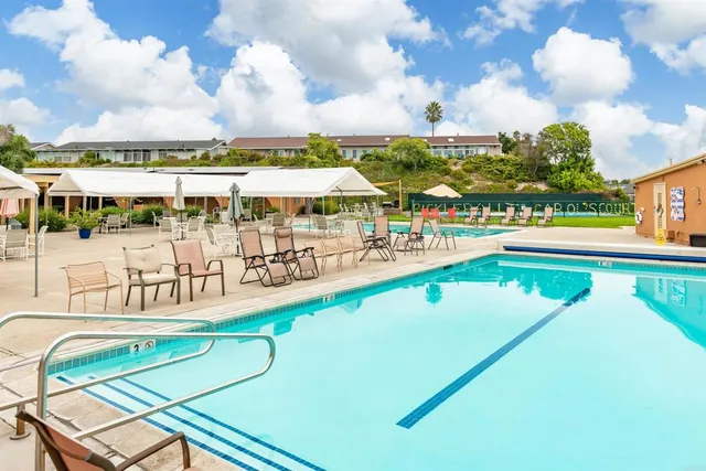 a view of a swimming pool with an outdoor seating
