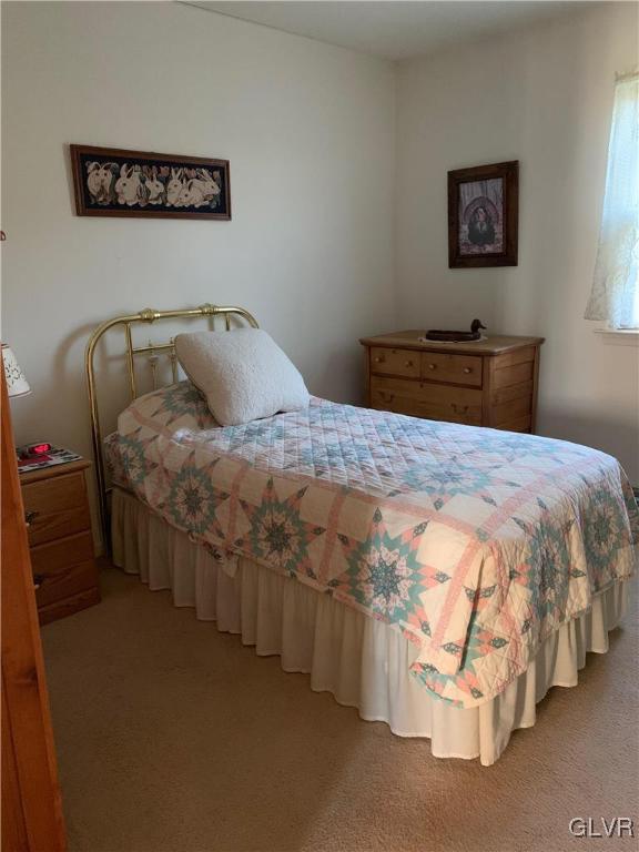 619 Stoney Run Road Pottsville, PA 17901 - Photo 12 of 15 a bedroom with a bed and a lamp on table