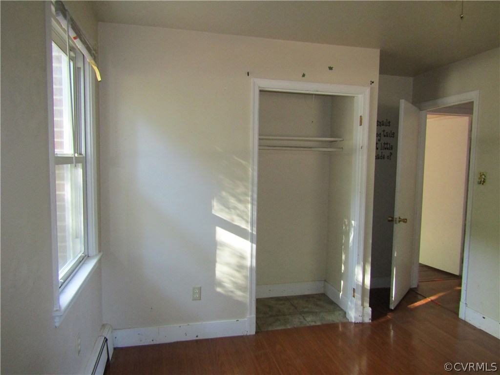 5450 Catterick Road North Chesterfield, VA 23234 - Photo 21 of 29 an empty room with wooden floor and windows