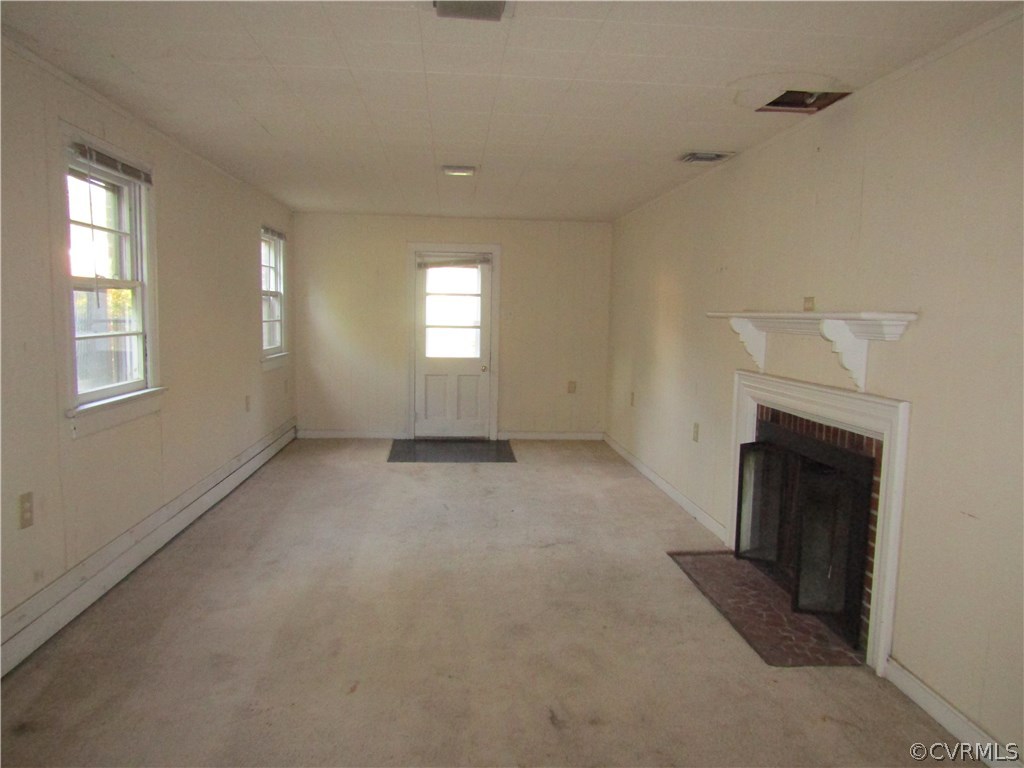 5450 Catterick Road North Chesterfield, VA 23234 - Photo 25 of 29 an empty room with a fireplace and windows