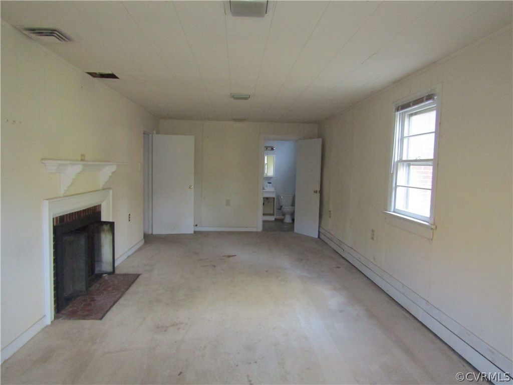 5450 Catterick Road North Chesterfield, VA 23234 - Photo 26 of 29 an empty room with a fireplace and windows