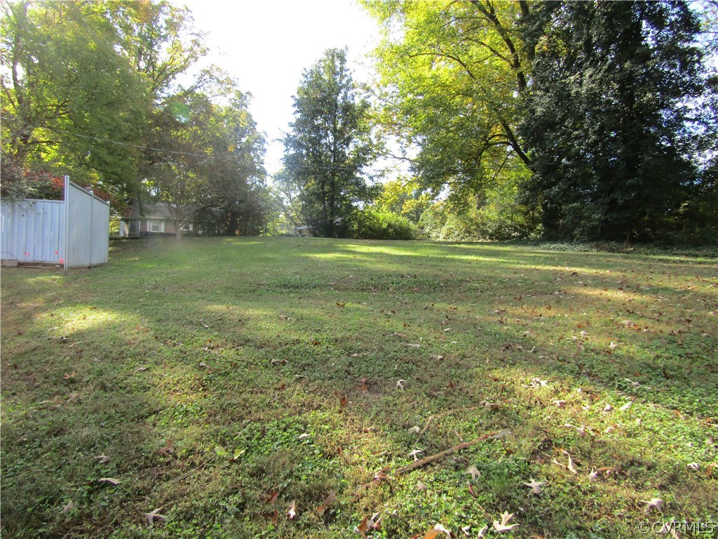 5450 Catterick Road North Chesterfield, VA 23234 - Photo 6 of 29 a view of a field with trees in the background
