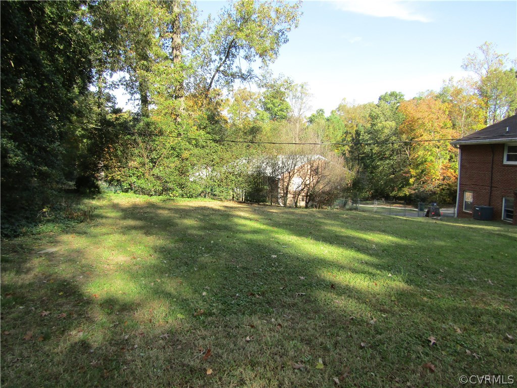 5450 Catterick Road North Chesterfield, VA 23234 - Photo 7 of 29 a view of a grassy field with trees