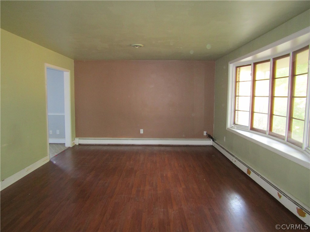 5450 Catterick Road North Chesterfield, VA 23234 - Photo 8 of 29 a view of an empty room with wooden floor and a window