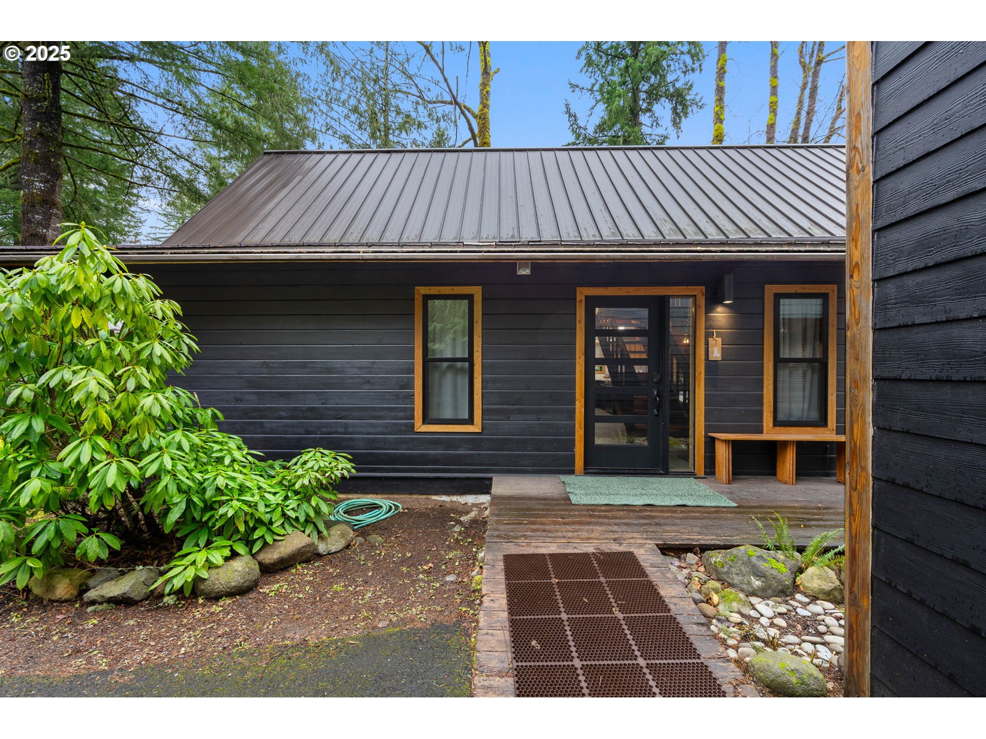 65418 East Sandy River Lane Rhododendron, OR 97049 - Photo 4 of 47 a view of a house with a door and wooden floor