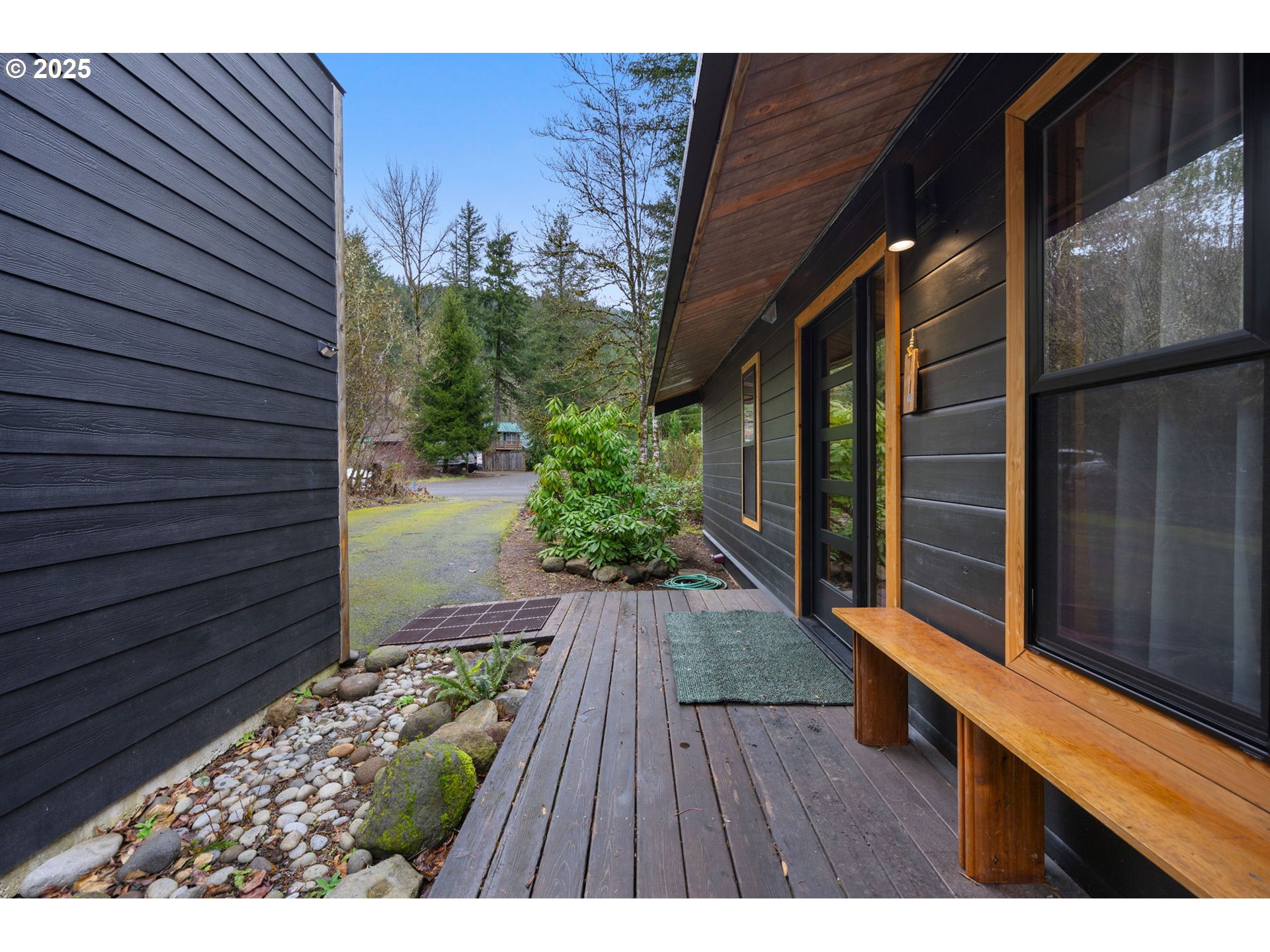 65418 East Sandy River Lane Rhododendron, OR 97049 - Photo 5 of 47 a view of backyard with wooden floor and a potted plant