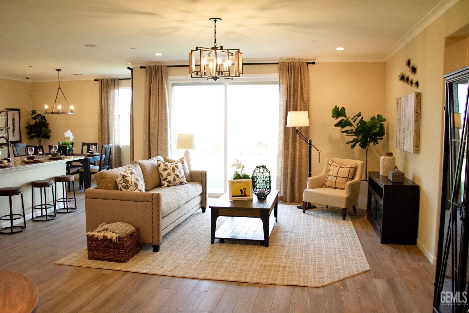 Undisclosed Address Delano, CA 93215 - Photo 2 of 7 a living room with furniture and a chandelier