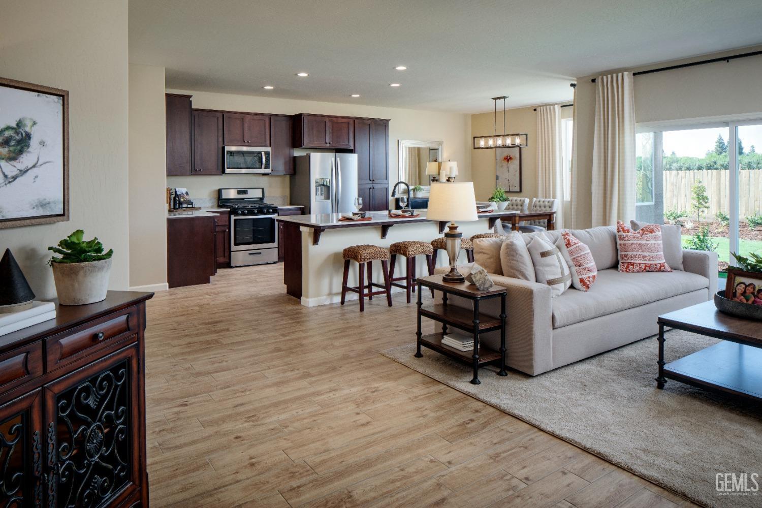 Undisclosed Address Delano, CA 93215 - Photo 5 of 7 a living room with furniture appliances and a large window