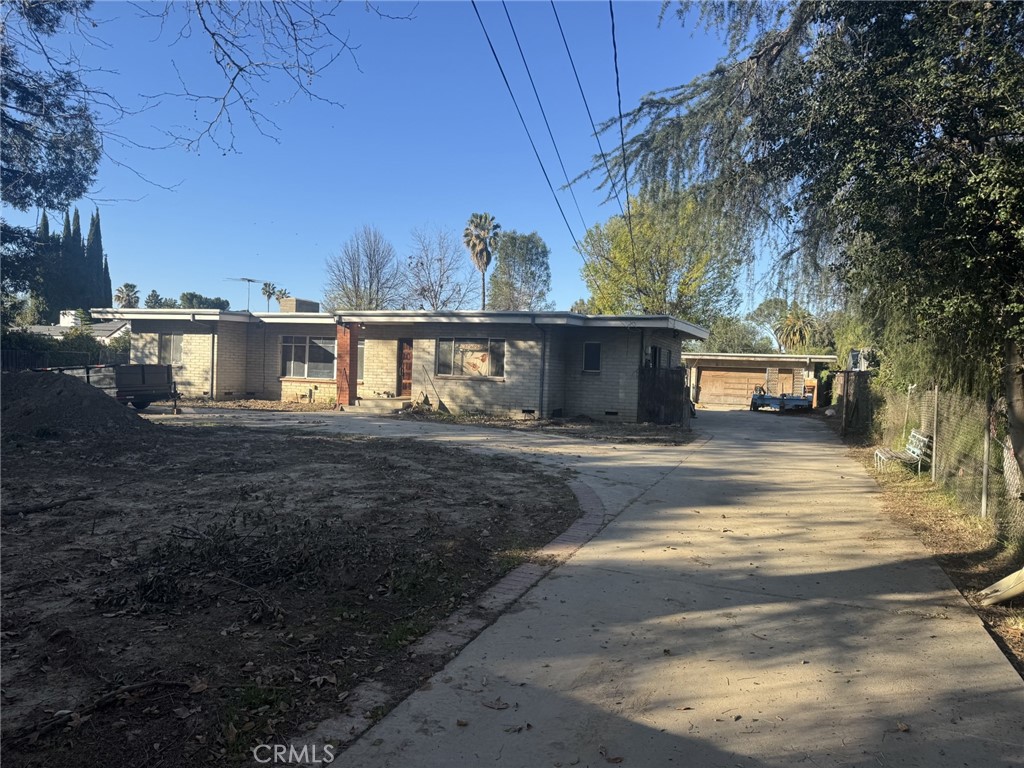 17545 Community Street Northridge, CA 91325 - Photo 1 of 22 a view of building with car parked