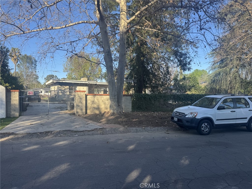 17545 Community Street Northridge, CA 91325 - Photo 2 of 22 a front view of a house with parking space