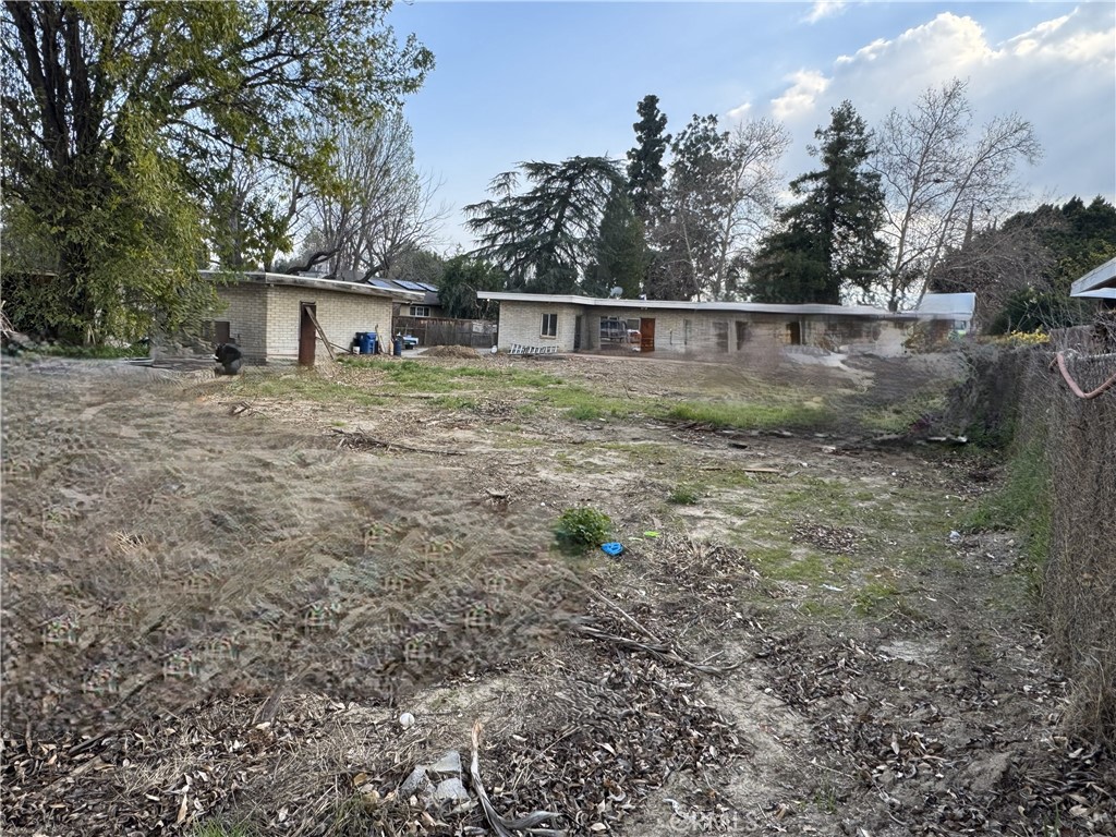 17545 Community Street Northridge, CA 91325 - Photo 4 of 22 a front view of a house with garden