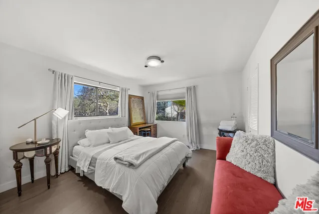 a bedroom with bed and window