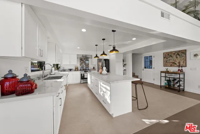a kitchen with stainless steel appliances lots of counter top space