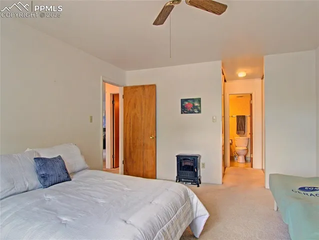 a bedroom with a bed and a table