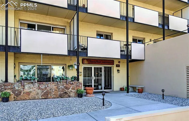 a view of a building with sitting area