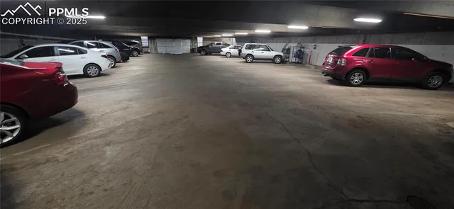 a view of parking with cars parked