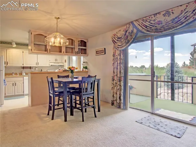 a view of a dining room with furniture window and outside view