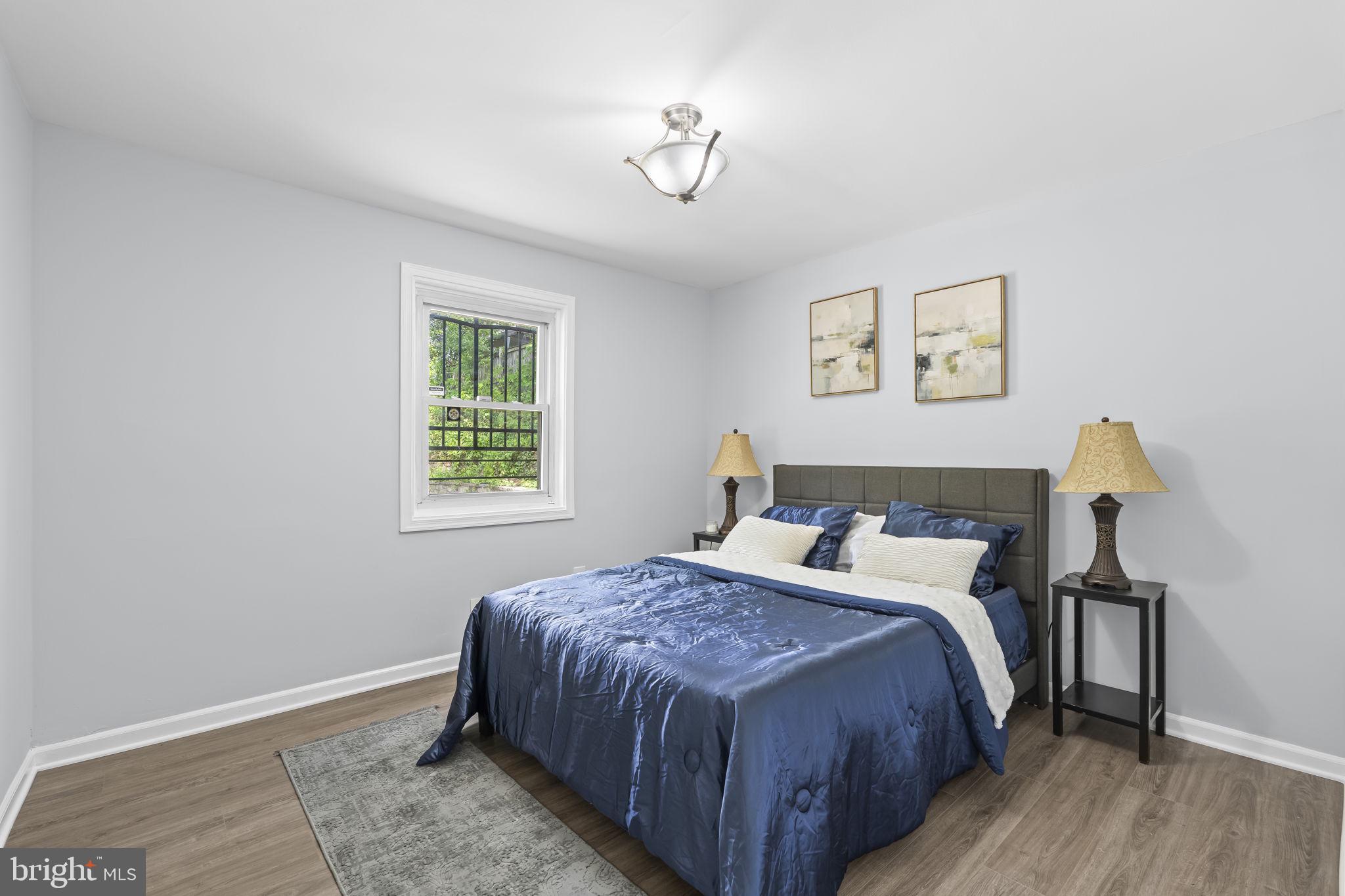 5414 Taussig Road Bladensburg, MD 20710 - Photo 13 of 26 Serene bedroom with natural light.