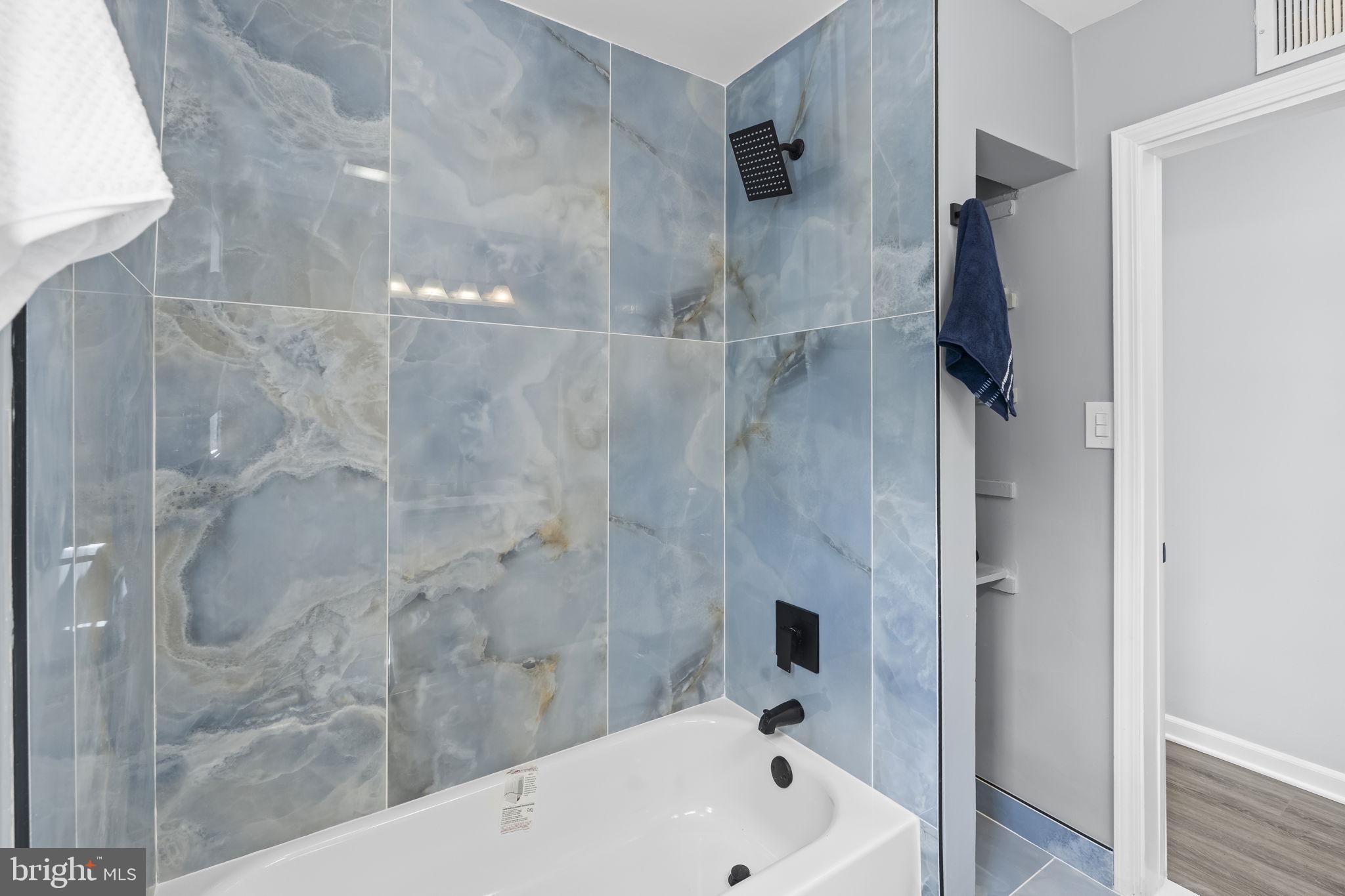 5414 Taussig Road Bladensburg, MD 20710 - Photo 18 of 26 Sleek bathroom with elegant tiles.