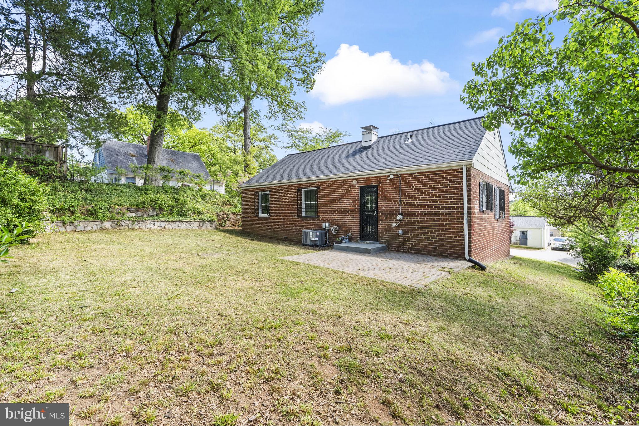 5414 Taussig Road Bladensburg, MD 20710 - Photo 24 of 26 Charming brick home with lush greenery.