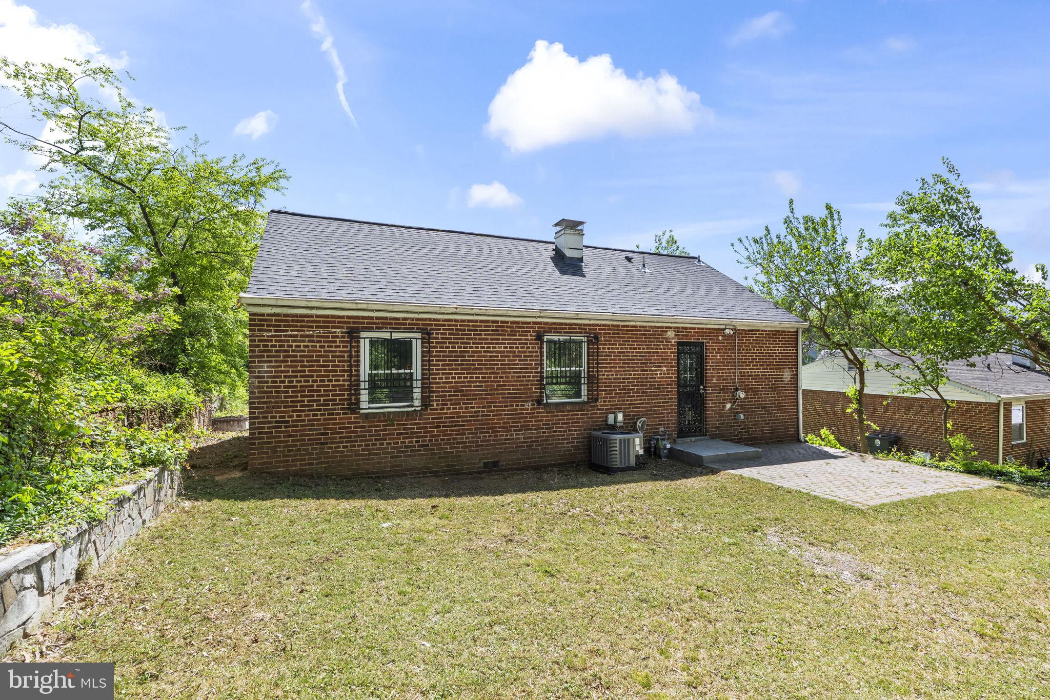 5414 Taussig Road Bladensburg, MD 20710 - Photo 26 of 26 Charming brick home with lush greenery.
