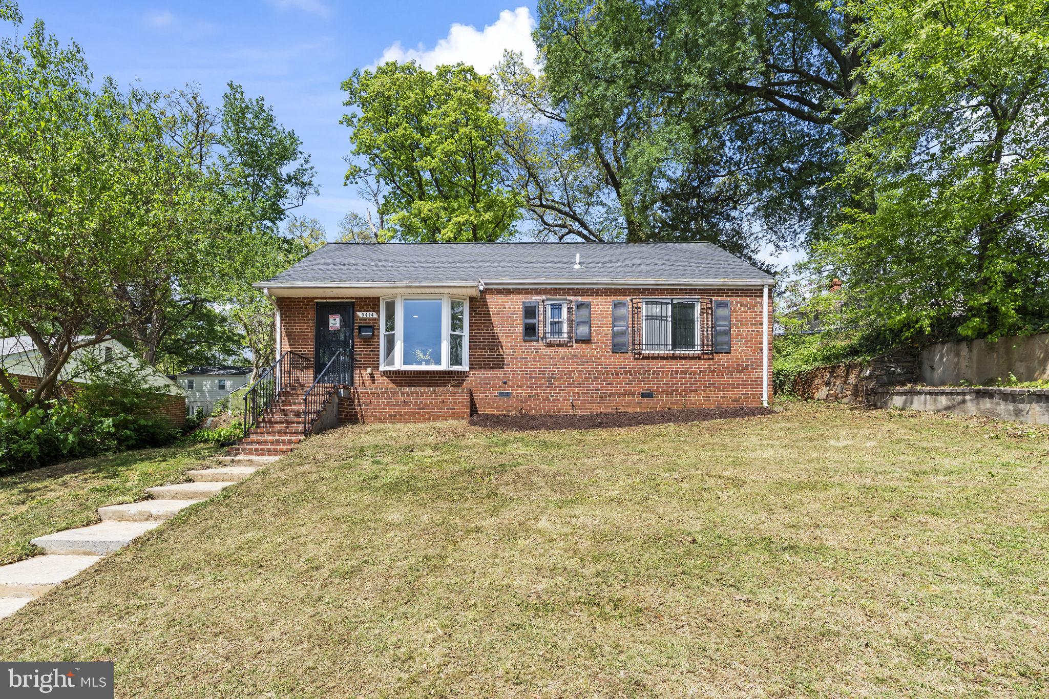 5414 Taussig Road Bladensburg, MD 20710 - Photo 3 of 26 Charming brick home with lush greenery.