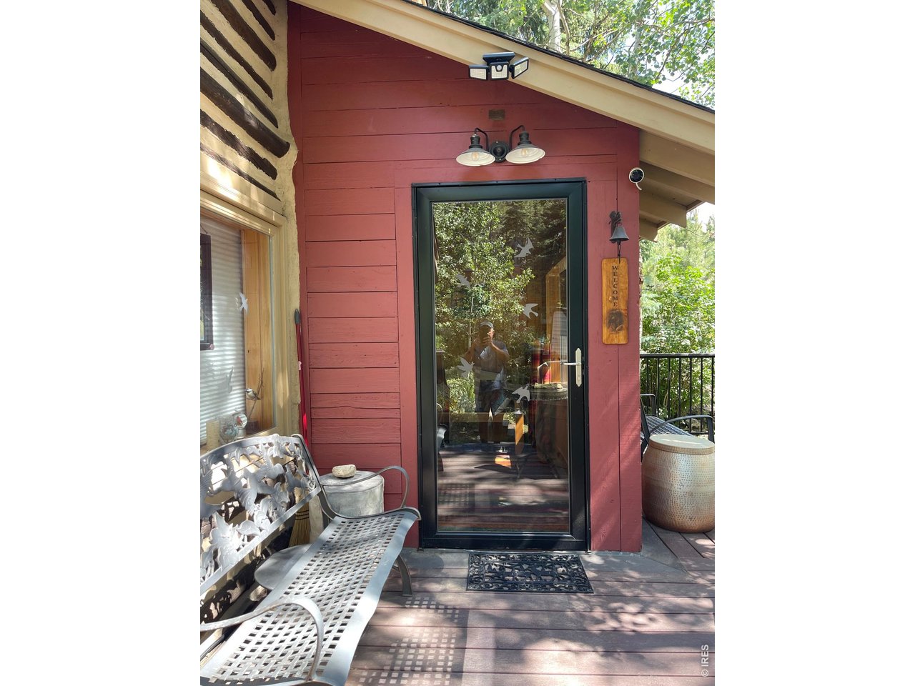 124 Ski Road Allenspark, CO 80510 - Photo 5 of 29 a view of a door and chair in the balcony