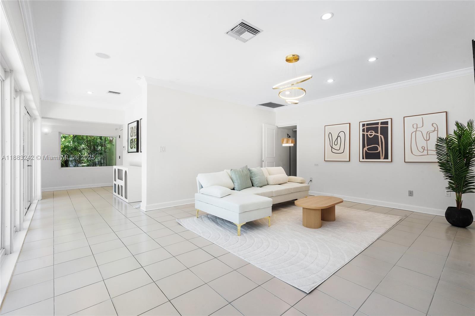 5810 Maggiore Street, Unit 5810 Coral Gables, FL 33146 - Photo 16 of 37 a living room with furniture