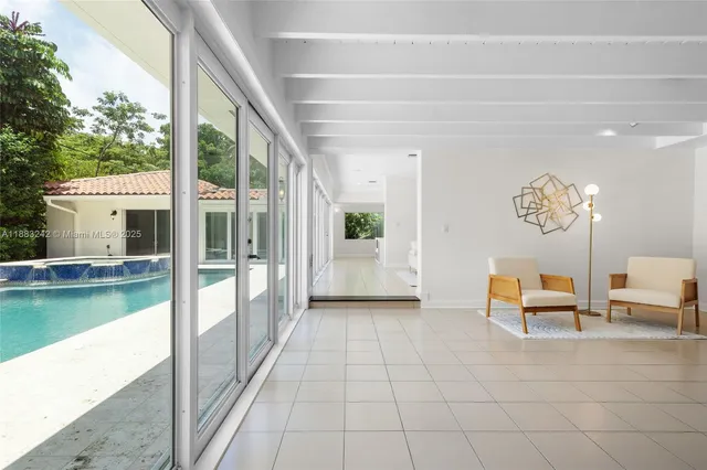 a view of a balcony with table and chairs