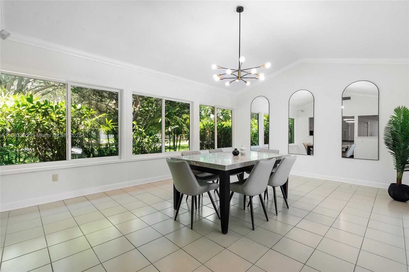 5810 Maggiore Street, Unit 5810 Coral Gables, FL 33146 - Photo 20 of 37 a view of a dining room with furniture window and outside view