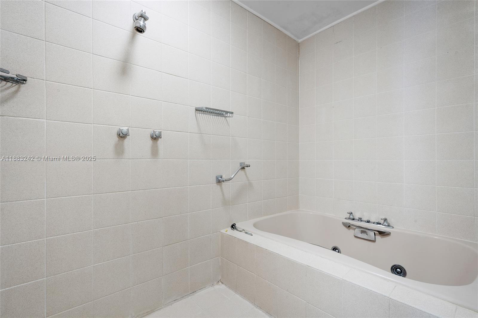 5810 Maggiore Street, Unit 5810 Coral Gables, FL 33146 - Photo 27 of 37 a bathroom with a bathtub