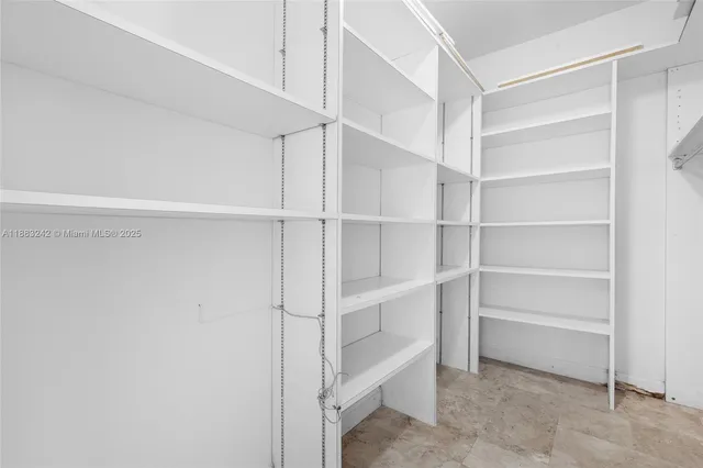 a view of an empty walk in closet