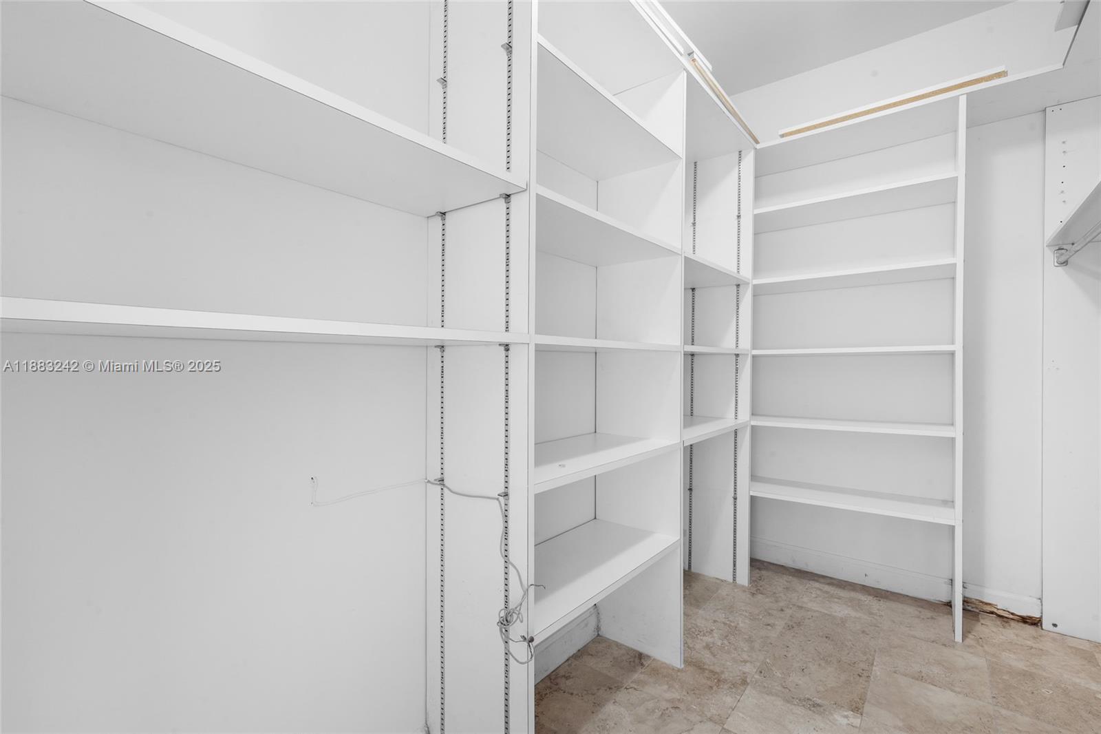 5810 Maggiore Street, Unit 5810 Coral Gables, FL 33146 - Photo 29 of 37 a view of an empty walk in closet