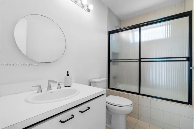 a bedroom with a bed and a ceiling fan