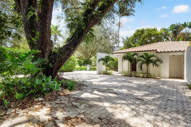 a view of a house with a tree