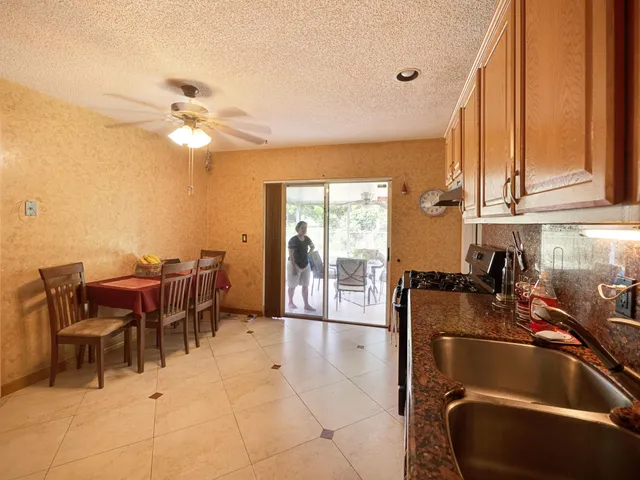 a kitchen with a table chairs and a dining table