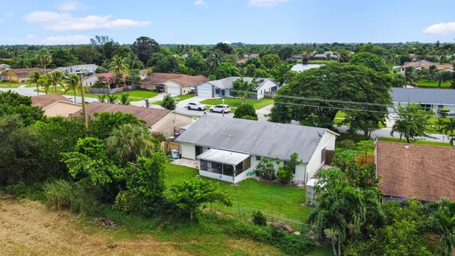 an aerial view of a house with outdoor space and street view