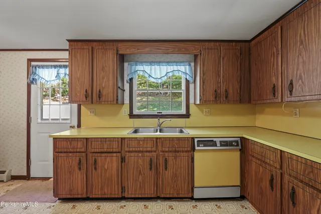 a kitchen with a sink and a window