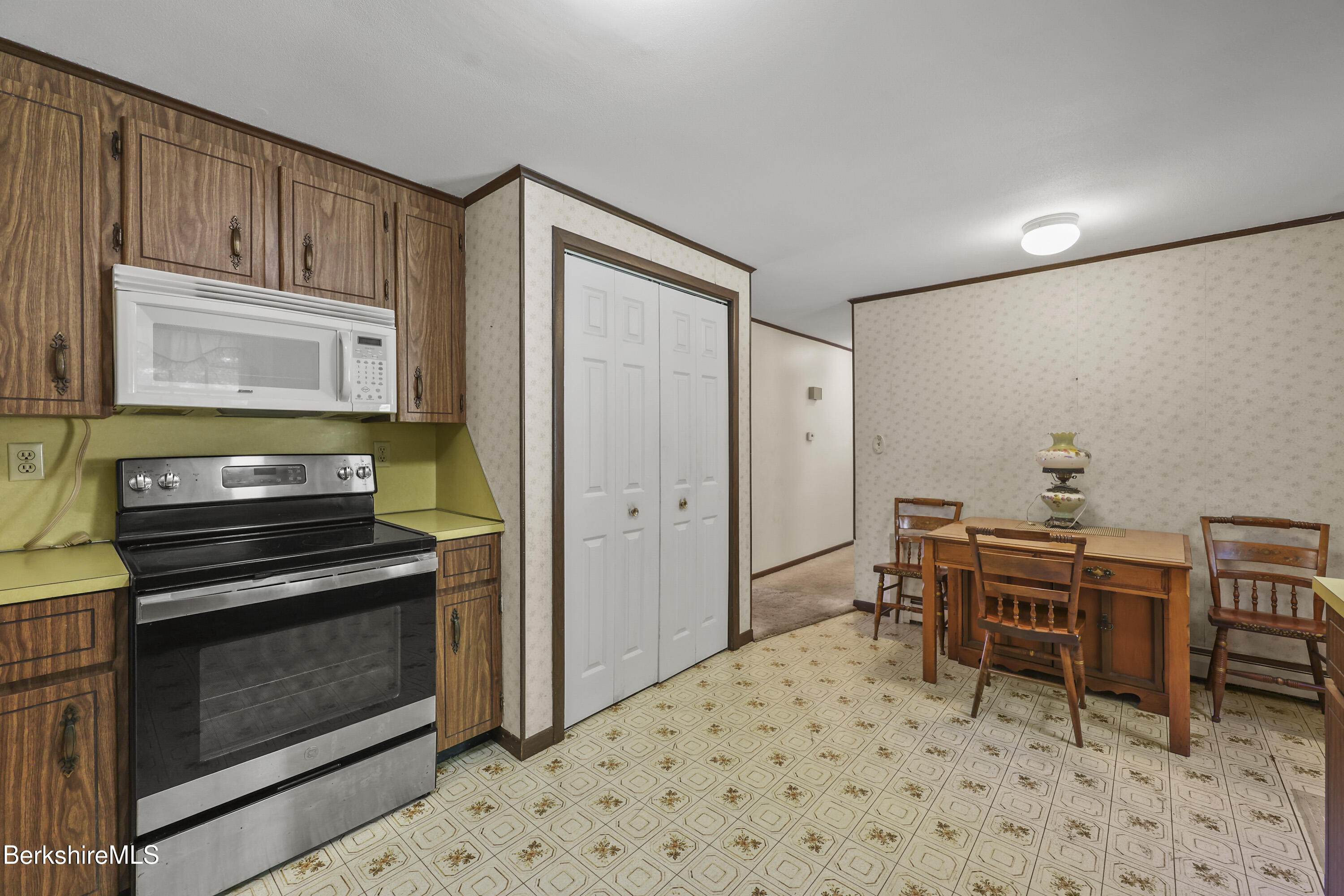 378 E Road Clarksburg, MA 01247 - Photo 15 of 36 a kitchen with a stove and a refrigerator