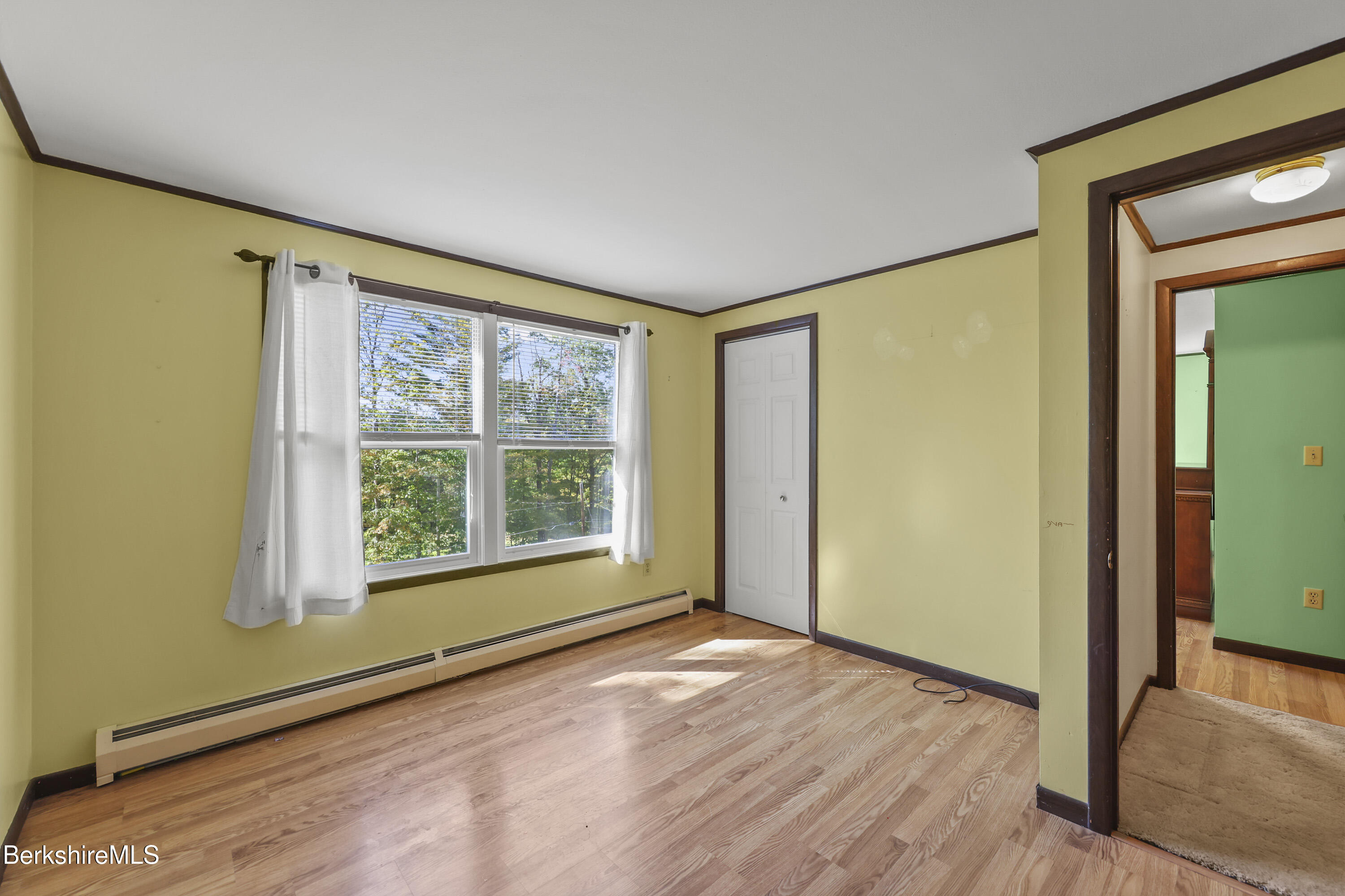378 E Road Clarksburg, MA 01247 - Photo 22 of 36 a view of an empty room with glass door and a window