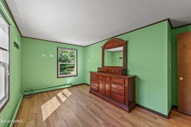 a room with a bed and a window