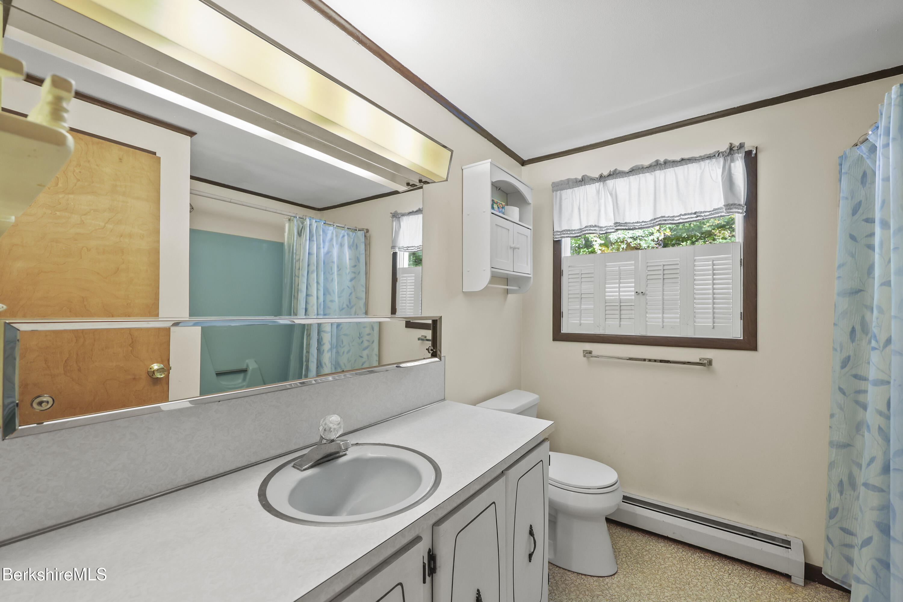 378 E Road Clarksburg, MA 01247 - Photo 27 of 36 a bathroom with a sink a toilet and shower