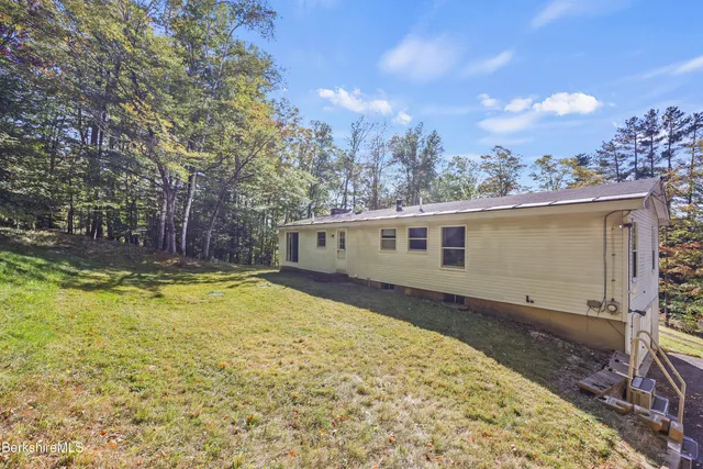 a house with trees in the background