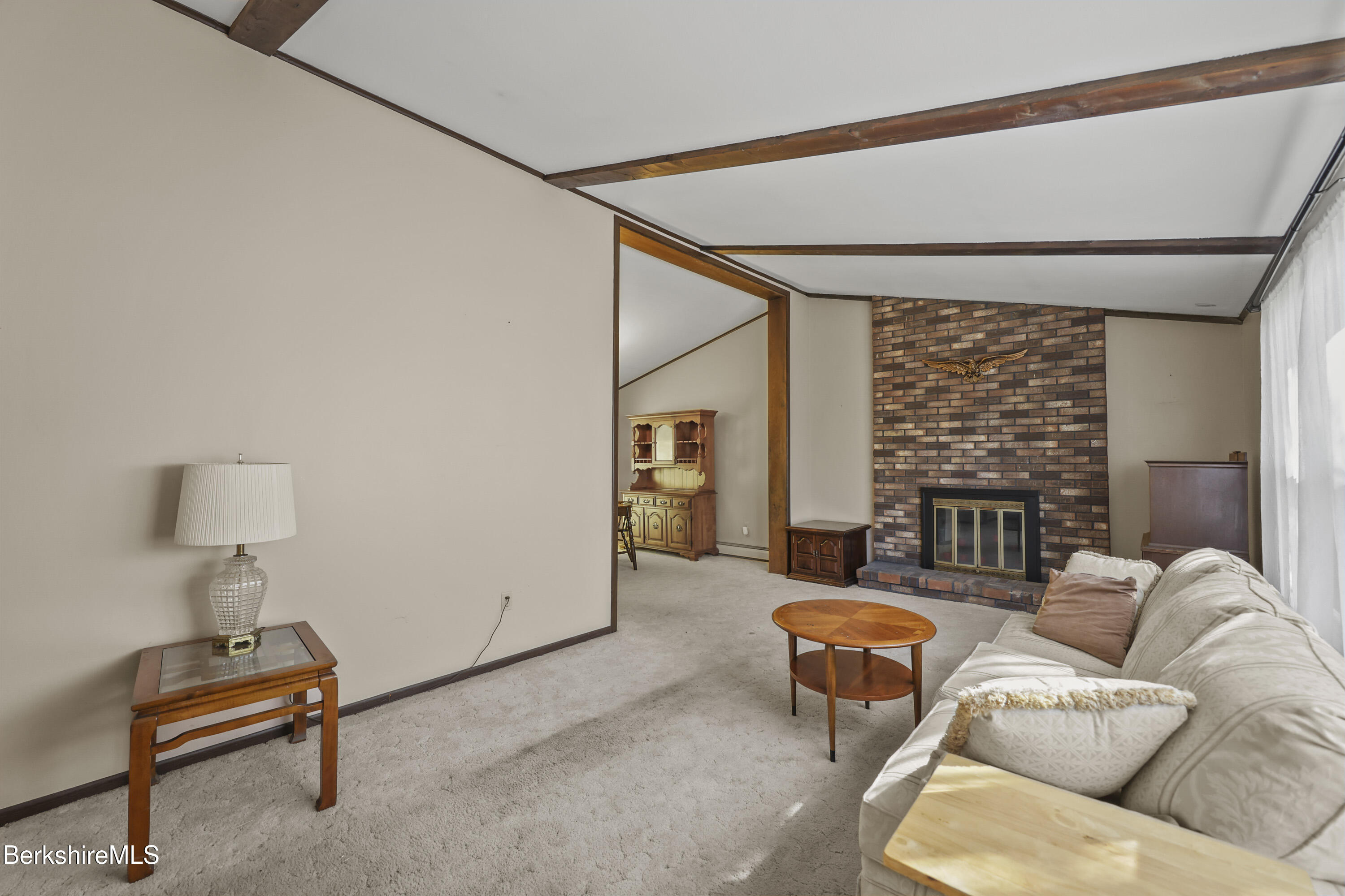 378 E Road Clarksburg, MA 01247 - Photo 4 of 36 a living room with furniture a ceiling fan and a large window
