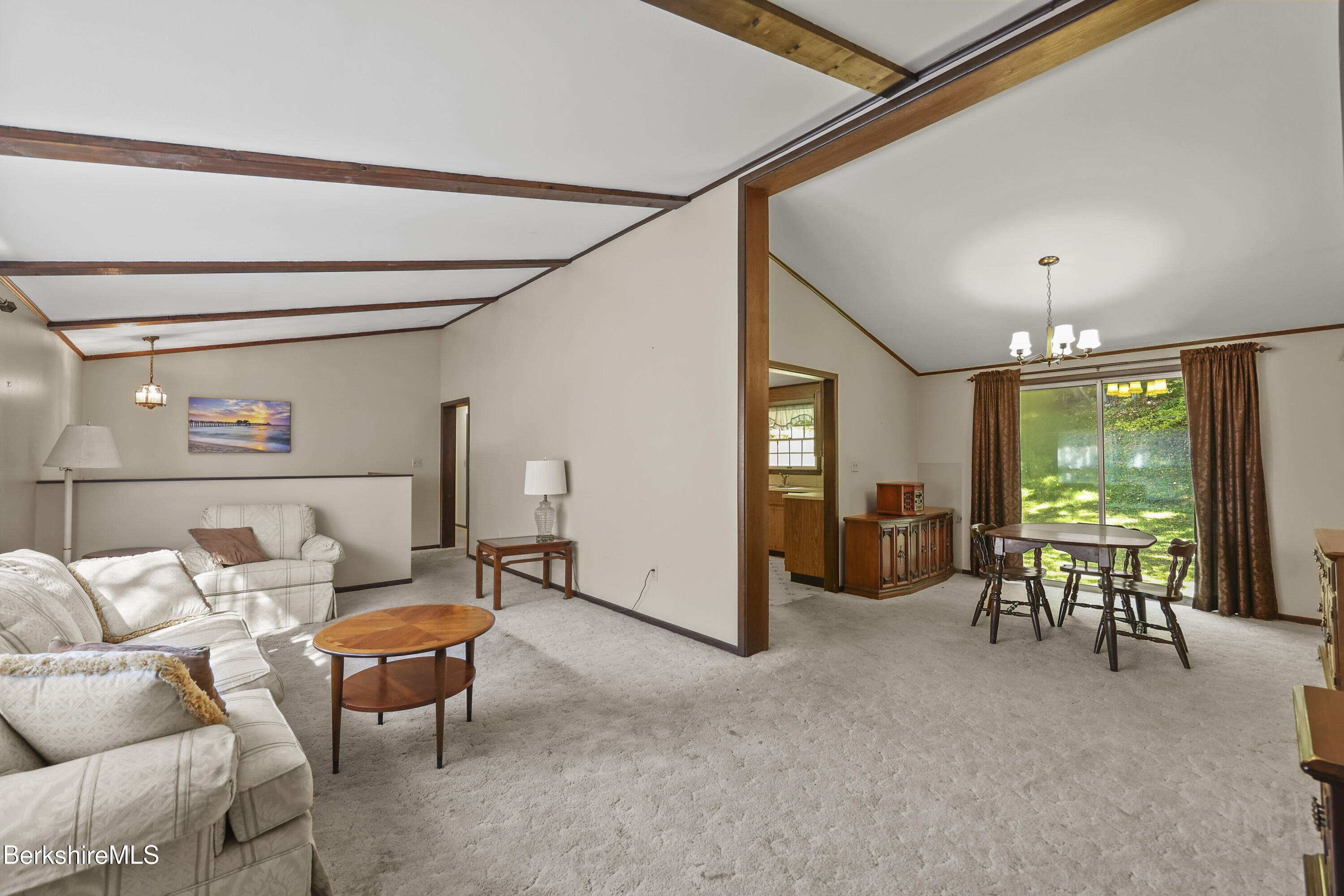378 E Road Clarksburg, MA 01247 - Photo 6 of 36 a living room with furniture a ceiling fan and a window