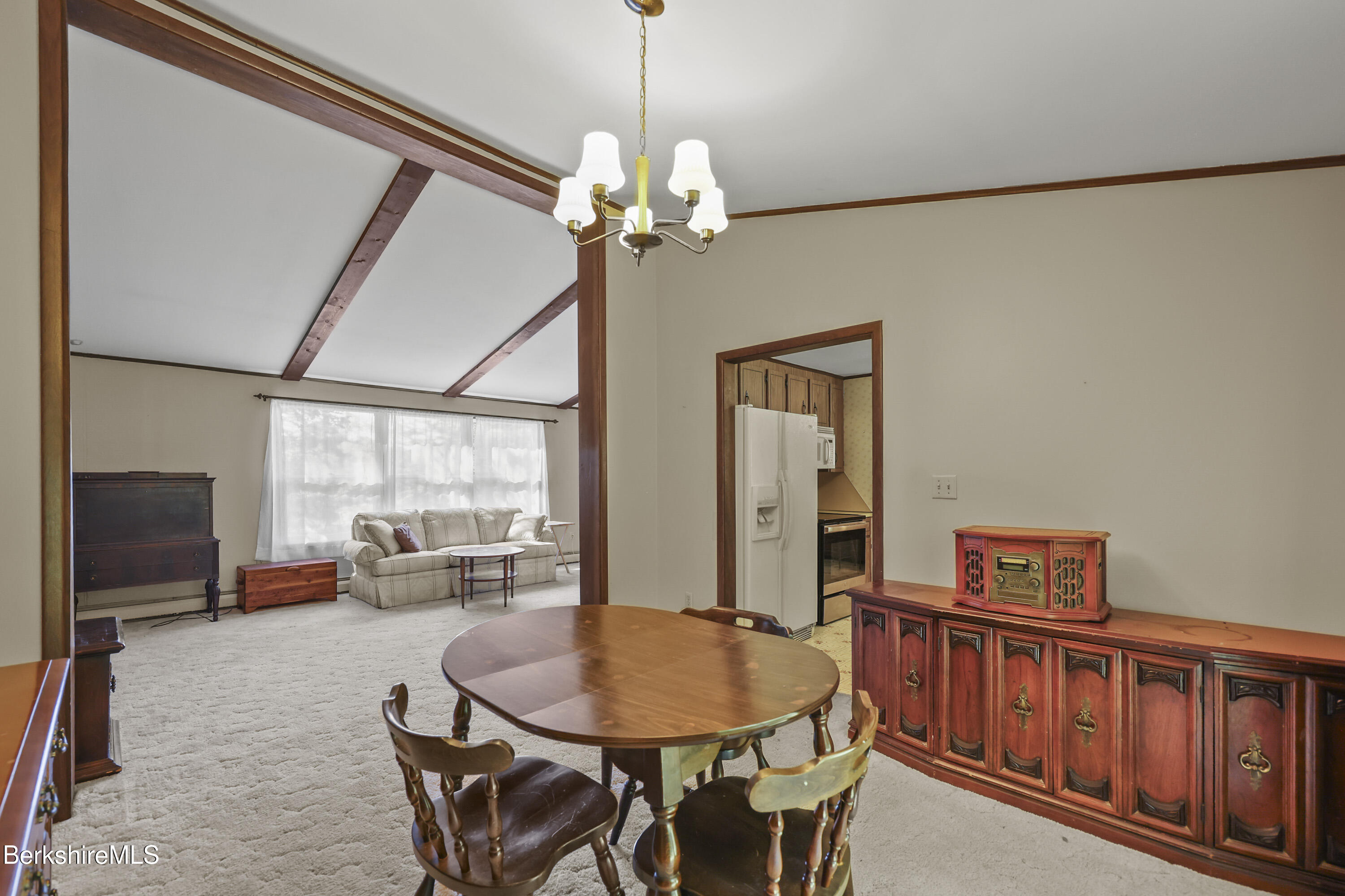 378 E Road Clarksburg, MA 01247 - Photo 9 of 36 a living room with furniture a flat screen tv and a window